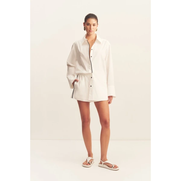 Long sleeve shirt in a white organic cotton poplin with black contrast binding.