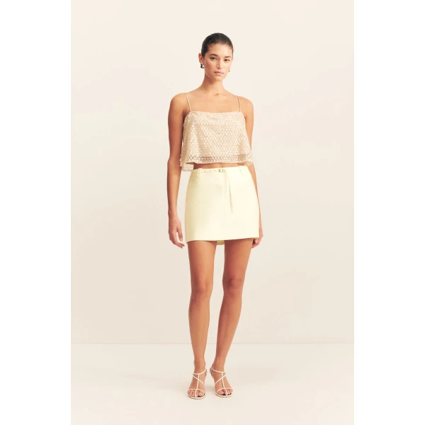 Belted mini skirt in yuzu in a luxurious cotton sateen blend.