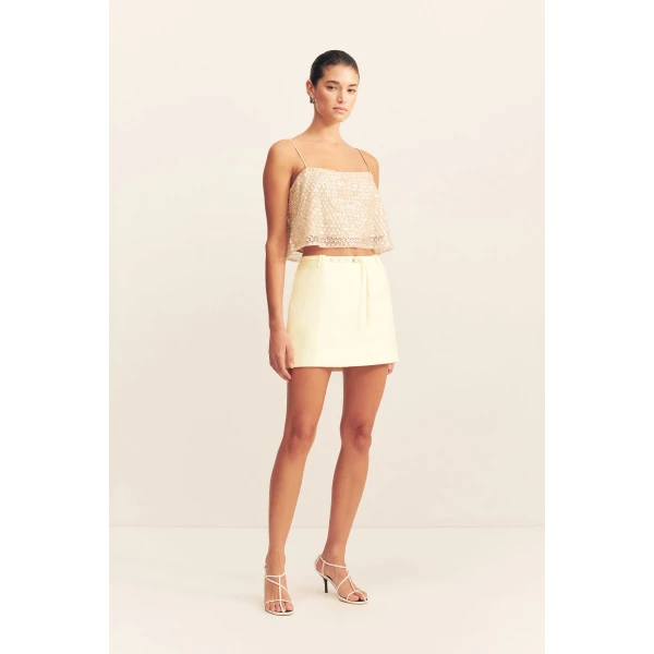 Belted mini skirt in yuzu in a luxurious cotton sateen blend.