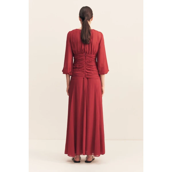 High neck balloon sleeve maxi dress in fuchsia in a semi-sheer georgette.