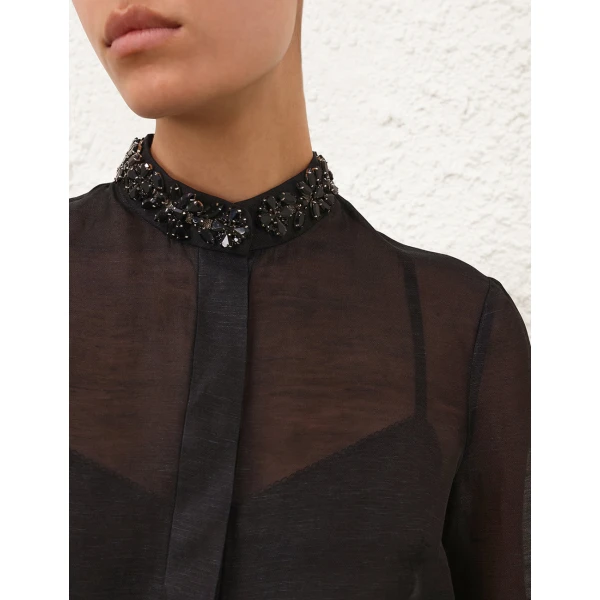 Elevate your elegance in this Zimmermann Tops   from the 2025 resort wear edit