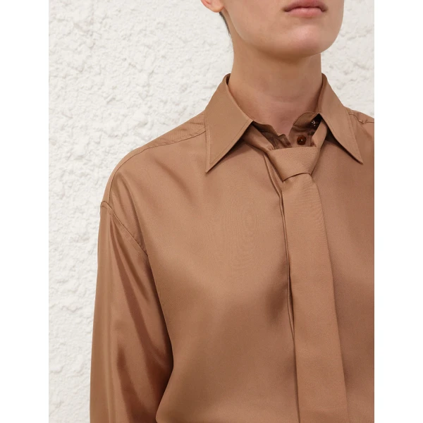 Elevate your elegance in this Zimmermann Tops   from the 2025 resort wear edit