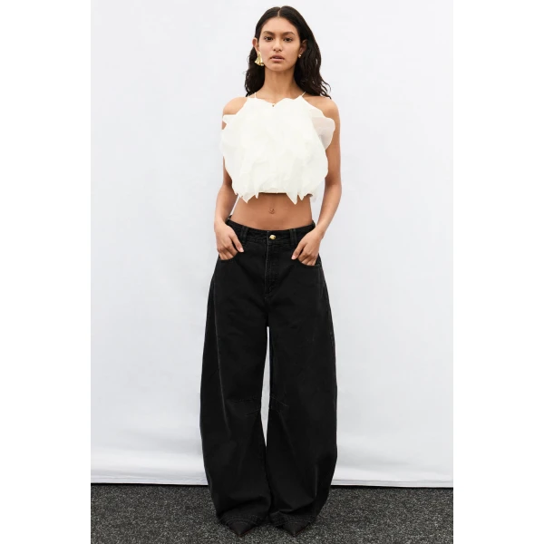 Aje Aus Pants – structured silhouette with raw femininity from Coveti