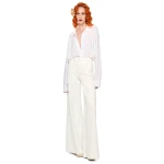 Elevate your elegance in this Norma Kamali  from the resort wear edit