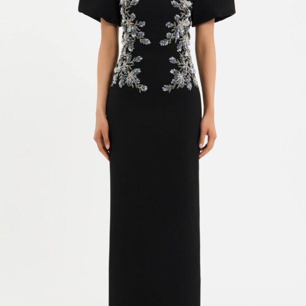 adorned with intricate floral beaded applique. Tailored from bonded crepe