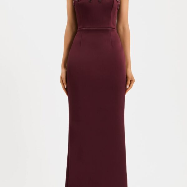 adorned with intricate hand embellished applique. Tailored from bonded satin
