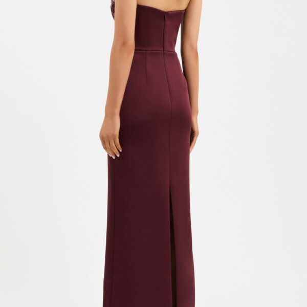 cinched at the waist to accentuate its flattering fit. The column maxi skirt creates an elegant silhouette