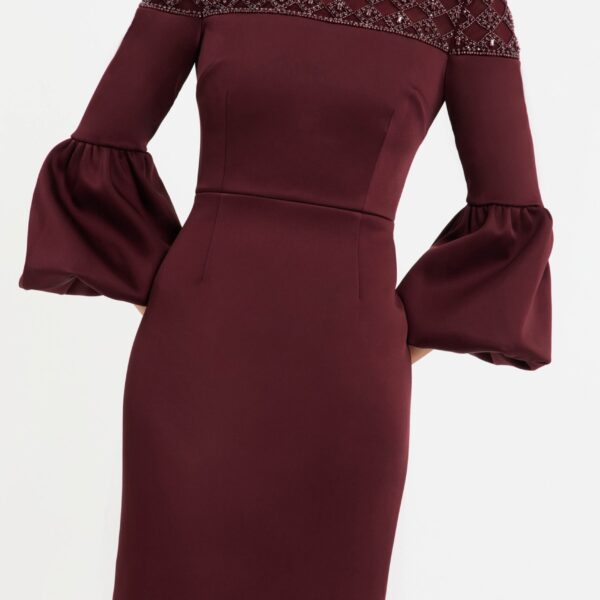enhanced with a back split for ease of wear. Fully lined and secured with a zip fastening at the back