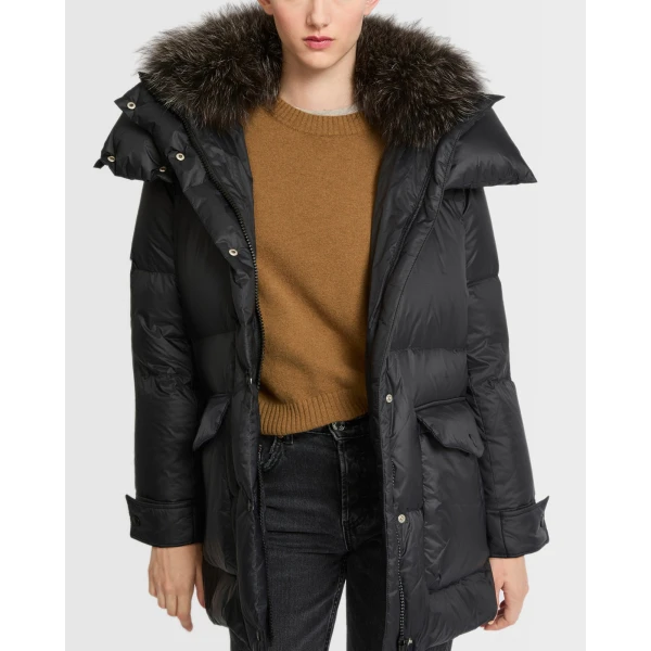 Woman wearing Yves Salomon shearling fur coat – luxury outerwear at Coveti