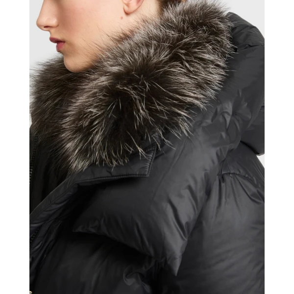 Woman wearing Yves Salomon shearling fur coat – luxury outerwear at Coveti