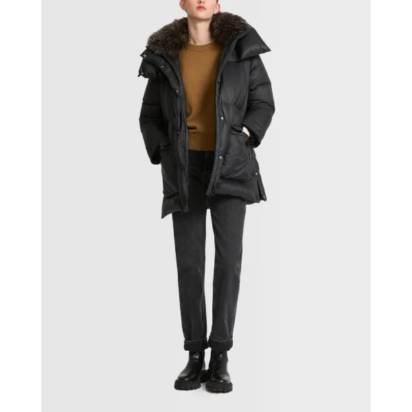 Woman wearing Yves Salomon shearling fur coat – luxury outerwear at Coveti