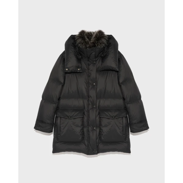 Woman wearing Yves Salomon shearling fur coat – luxury outerwear at Coveti
