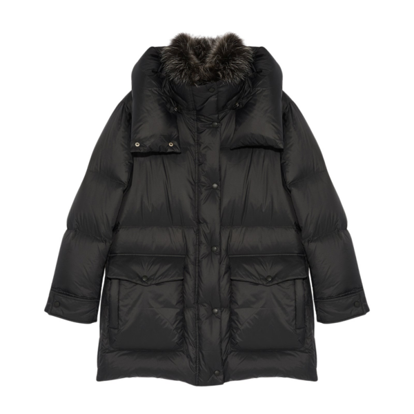 Woman wearing Yves Salomon shearling fur coat – luxury outerwear at Coveti