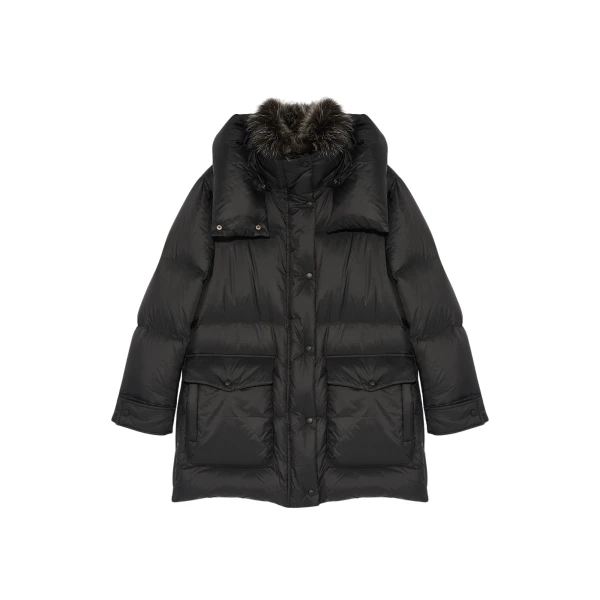 Woman wearing Yves Salomon shearling fur coat – luxury outerwear at Coveti