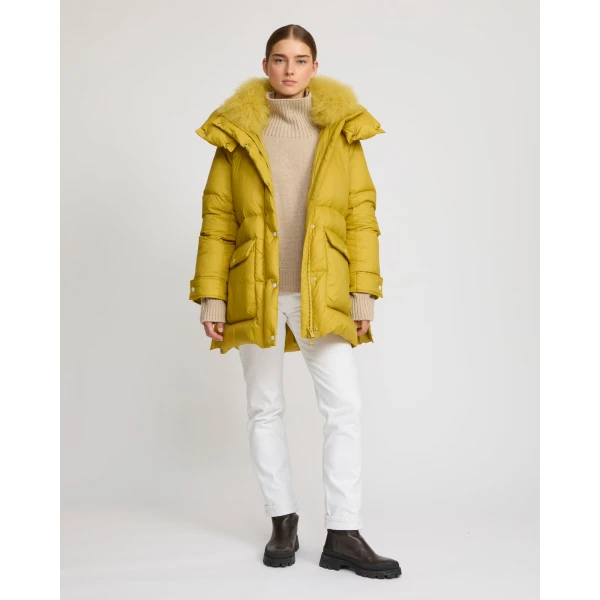 Woman wearing Yves Salomon shearling fur coat – luxury outerwear at Coveti