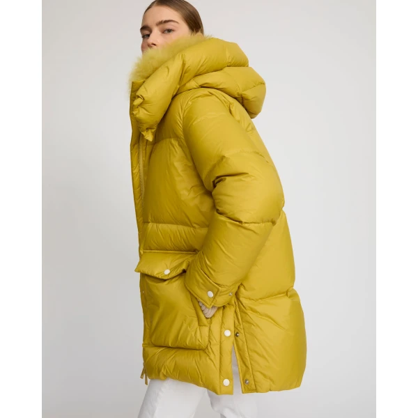 Woman wearing Yves Salomon shearling fur coat – luxury outerwear at Coveti