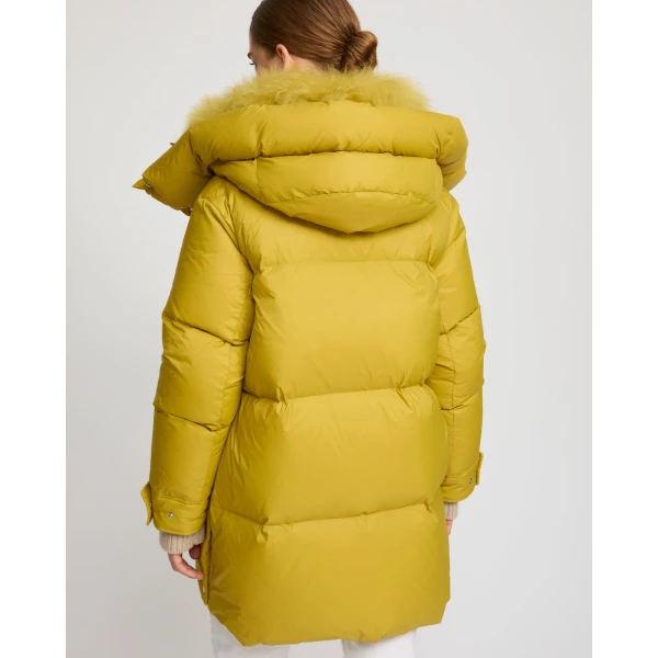 Woman wearing Yves Salomon shearling fur coat – luxury outerwear at Coveti