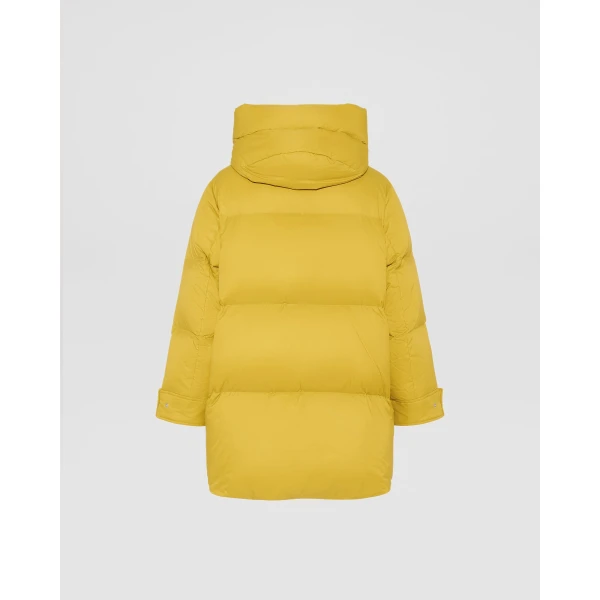 Woman wearing Yves Salomon shearling fur coat – luxury outerwear at Coveti