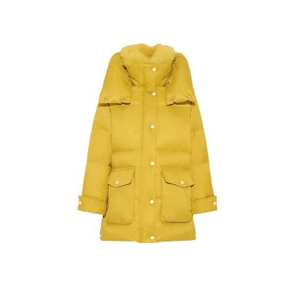 Woman wearing Yves Salomon shearling fur coat – luxury outerwear at Coveti