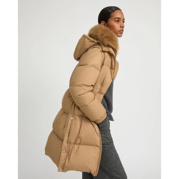Woman wearing Yves Salomon shearling fur coat – luxury outerwear at Coveti