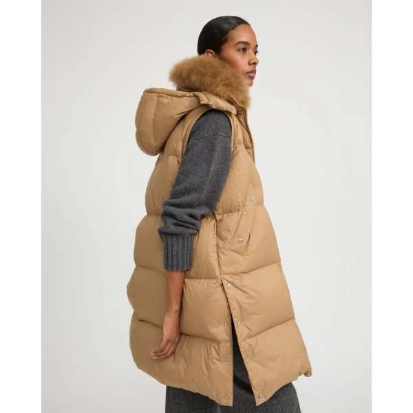 Woman wearing Yves Salomon shearling fur coat – luxury outerwear at Coveti