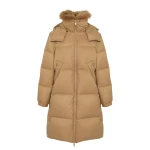 Woman wearing Yves Salomon shearling fur coat – luxury outerwear at Coveti