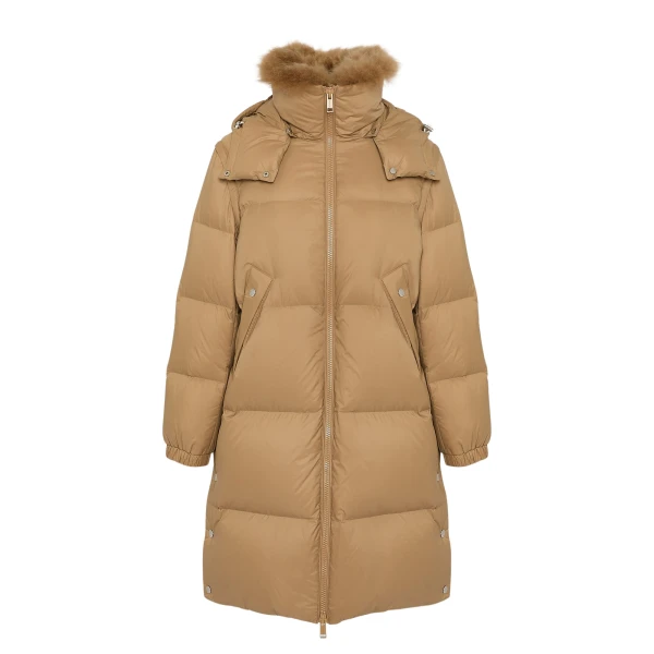 Woman wearing Yves Salomon shearling fur coat – luxury outerwear at Coveti