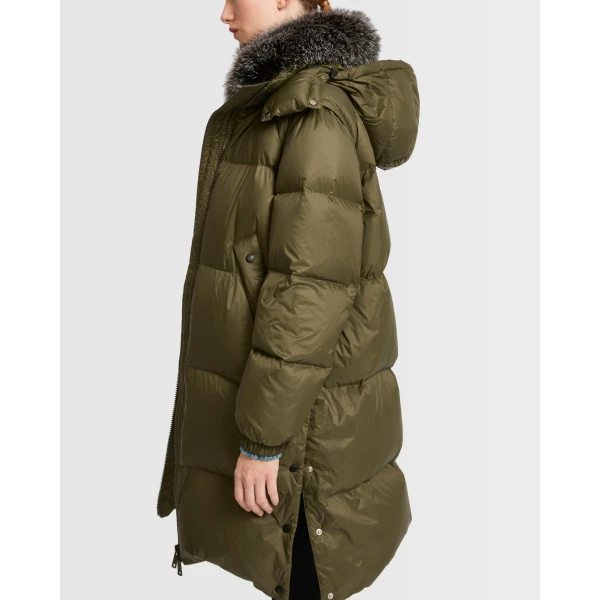 Woman wearing Yves Salomon shearling fur coat – luxury outerwear at Coveti