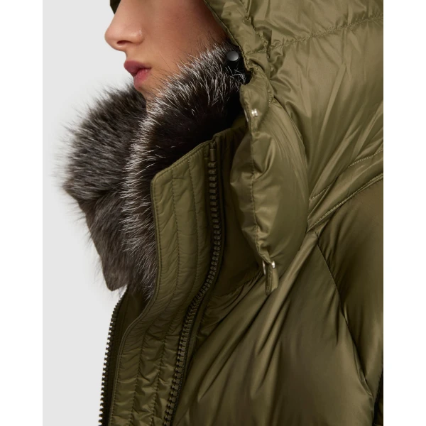 Woman wearing Yves Salomon shearling fur coat – luxury outerwear at Coveti
