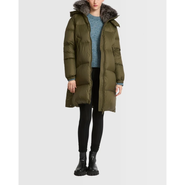 Woman wearing Yves Salomon shearling fur coat – luxury outerwear at Coveti