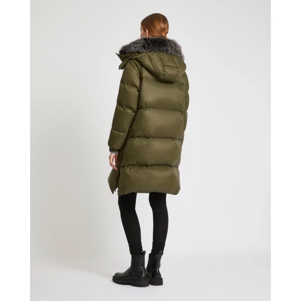Woman wearing Yves Salomon shearling fur coat – luxury outerwear at Coveti