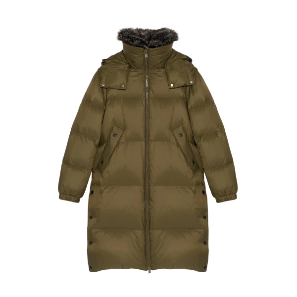 Woman wearing Yves Salomon shearling fur coat – luxury outerwear at Coveti