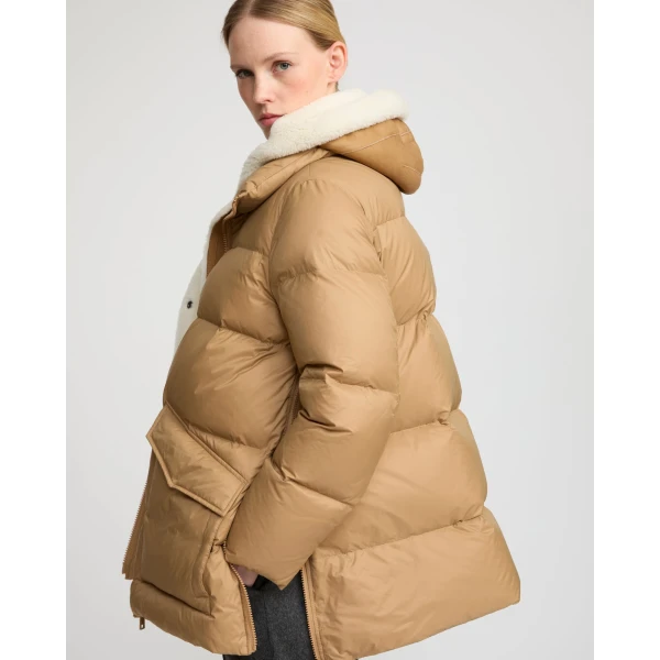 Woman wearing Yves Salomon shearling fur coat – luxury outerwear at Coveti