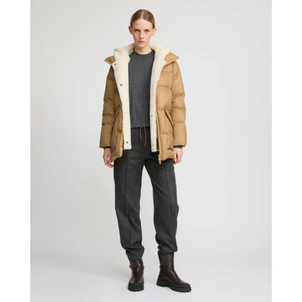 Woman wearing Yves Salomon shearling fur coat – luxury outerwear at Coveti