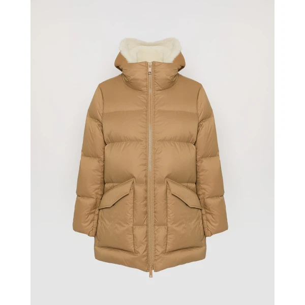 Woman wearing Yves Salomon shearling fur coat – luxury outerwear at Coveti