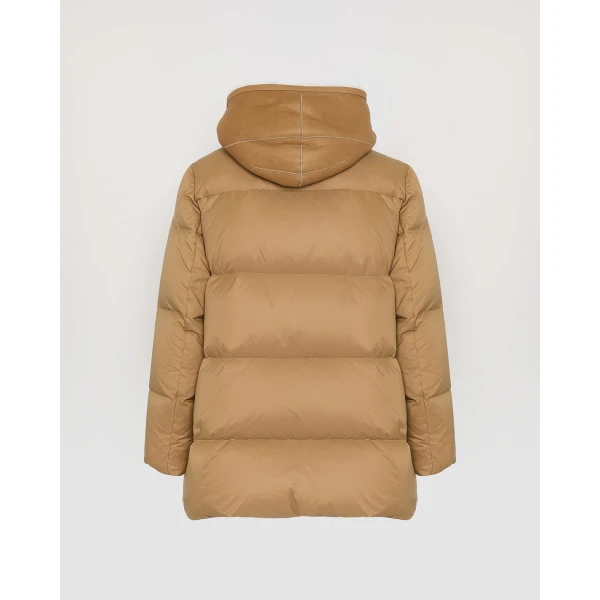 Woman wearing Yves Salomon shearling fur coat – luxury outerwear at Coveti