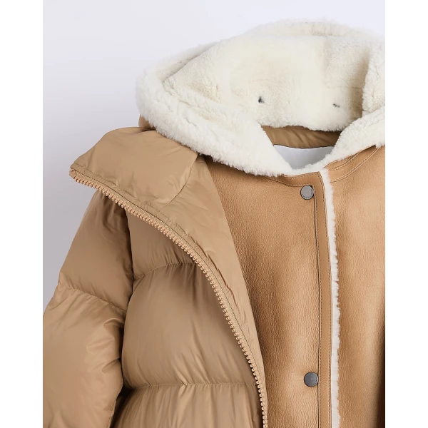 Woman wearing Yves Salomon shearling fur coat – luxury outerwear at Coveti