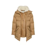 Woman wearing Yves Salomon shearling fur coat – luxury outerwear at Coveti