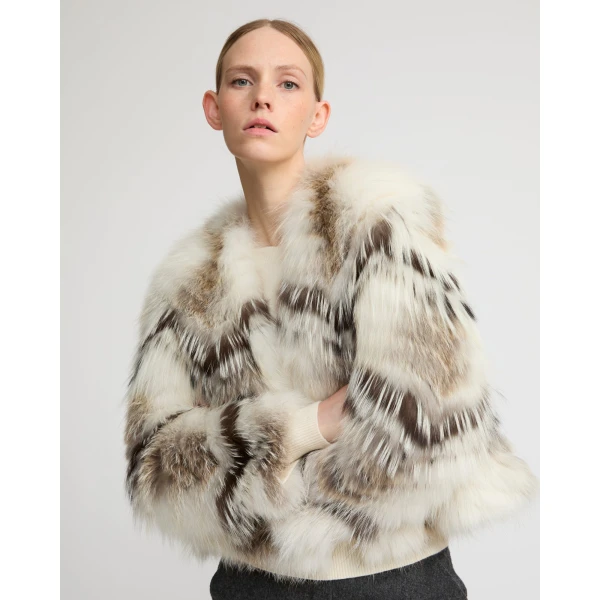 Woman wearing Yves Salomon shearling fur coat – luxury outerwear at Coveti