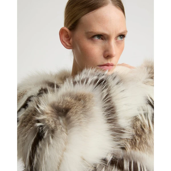 Woman wearing Yves Salomon shearling fur coat – luxury outerwear at Coveti