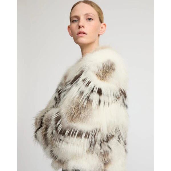 Woman wearing Yves Salomon shearling fur coat – luxury outerwear at Coveti