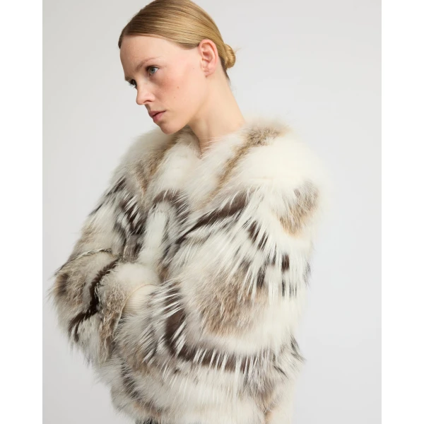 Woman wearing Yves Salomon shearling fur coat – luxury outerwear at Coveti