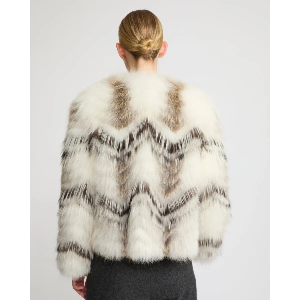 Woman wearing Yves Salomon shearling fur coat – luxury outerwear at Coveti