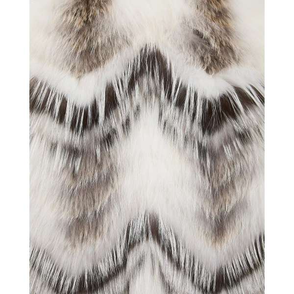 Woman wearing Yves Salomon shearling fur coat – luxury outerwear at Coveti