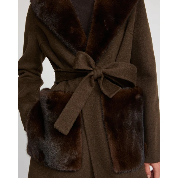 Woman wearing Yves Salomon shearling fur coat – luxury outerwear at Coveti