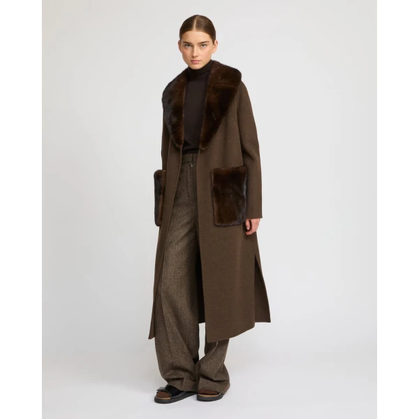 Woman wearing Yves Salomon shearling fur coat – luxury outerwear at Coveti