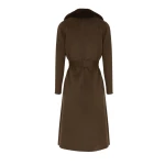 Woman wearing Yves Salomon shearling fur coat – luxury outerwear at Coveti