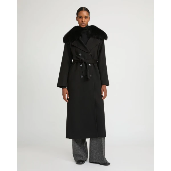 Woman wearing Yves Salomon shearling fur coat – luxury outerwear at Coveti