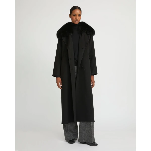 Woman wearing Yves Salomon shearling fur coat – luxury outerwear at Coveti
