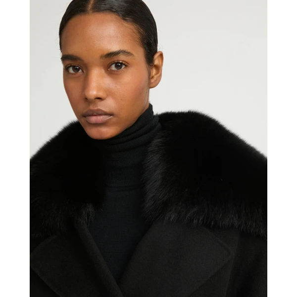 Woman wearing Yves Salomon shearling fur coat – luxury outerwear at Coveti